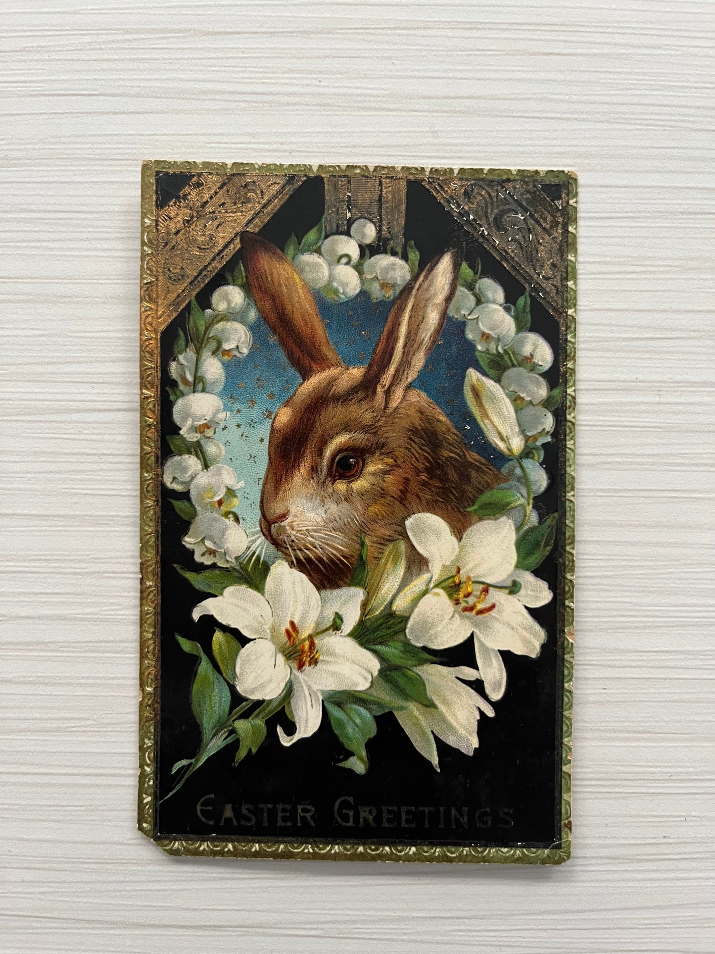 Antique Vintage Early 1900’s Bunny Rabbit Lilies Flowers Gel Gold Gilt Embossed Easter Greetings Postcard in Blue Frame - Made in Germany c1910's
