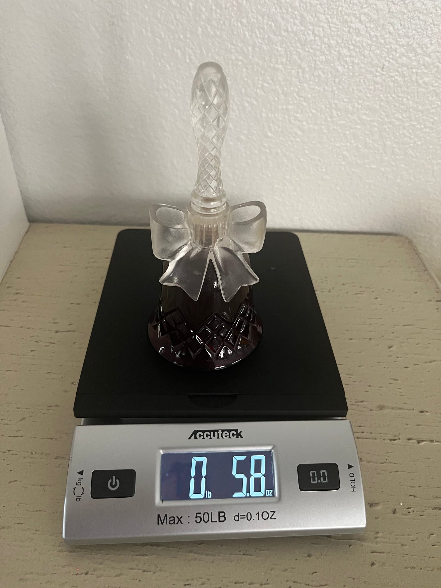 1970s vintage Avon Crystalsong Sonnet cologne Empty Ruby Red bottle in a bell shape with a clear  bow stopper