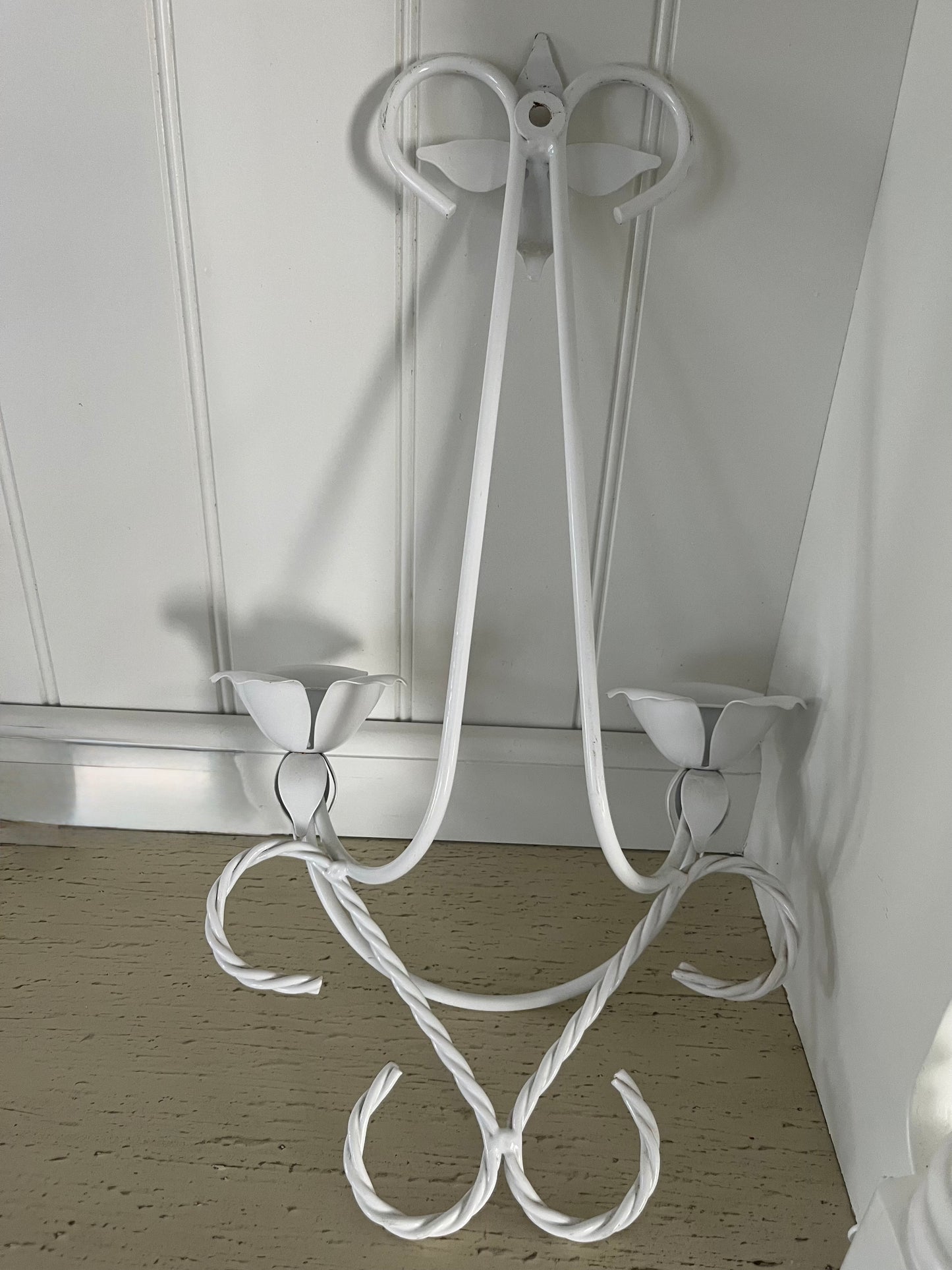 Vintage C.1980’s White Tole Double Wall Candle Sconce with tulip-shaped candle cups, and a four-pointed floral petal at the top