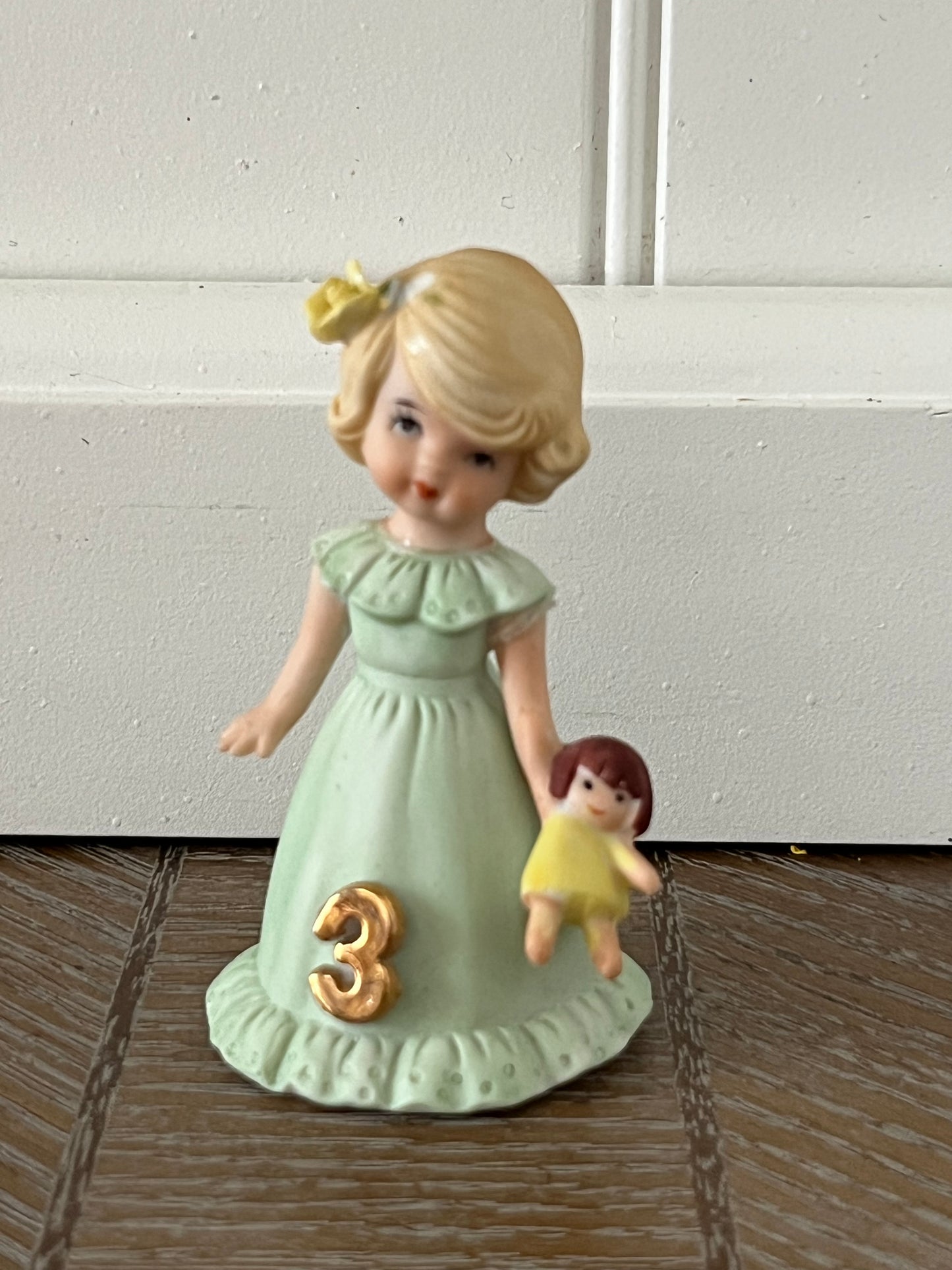 Vintage Enesco Growing Up Birthday Girls Age 3 Figurine – Bisque Porcelain Touched Up/Repaired Blonde Girl with Doll Pastel Green Dress (1980s–1990s)