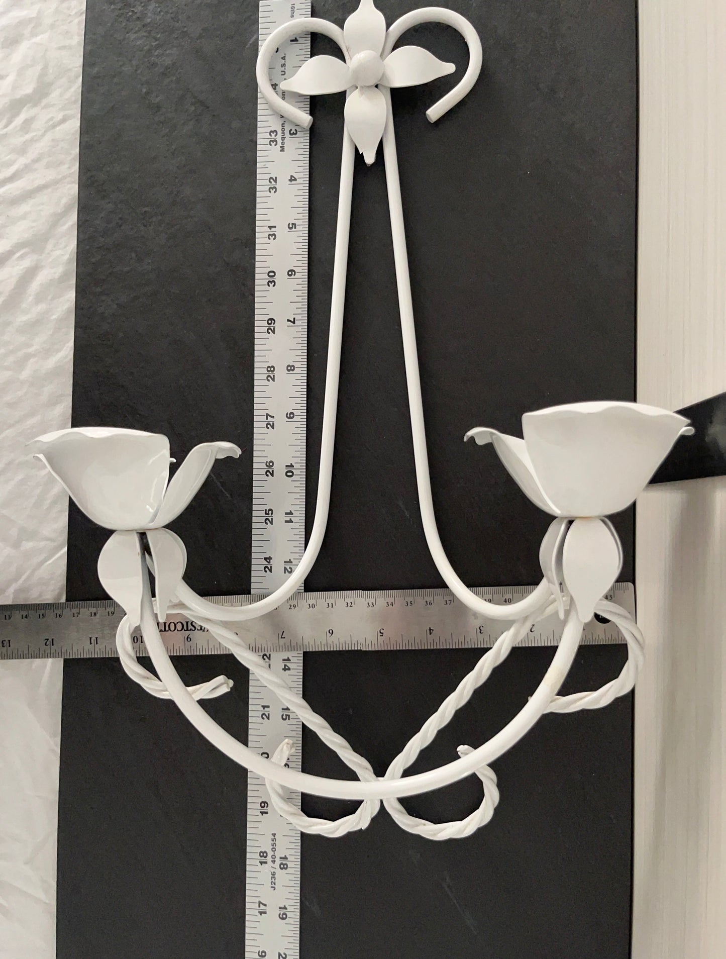 Vintage C.1980’s White Tole Double Wall Candle Sconce with tulip-shaped candle cups, and a four-pointed floral petal at the top