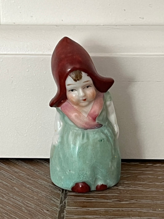 Vintage 1920s–1930s Mini Hand-Painted Dutch Bonnet Girl Porcelain Shaker Figurine – Mint Green Dress & Rust Red Hood