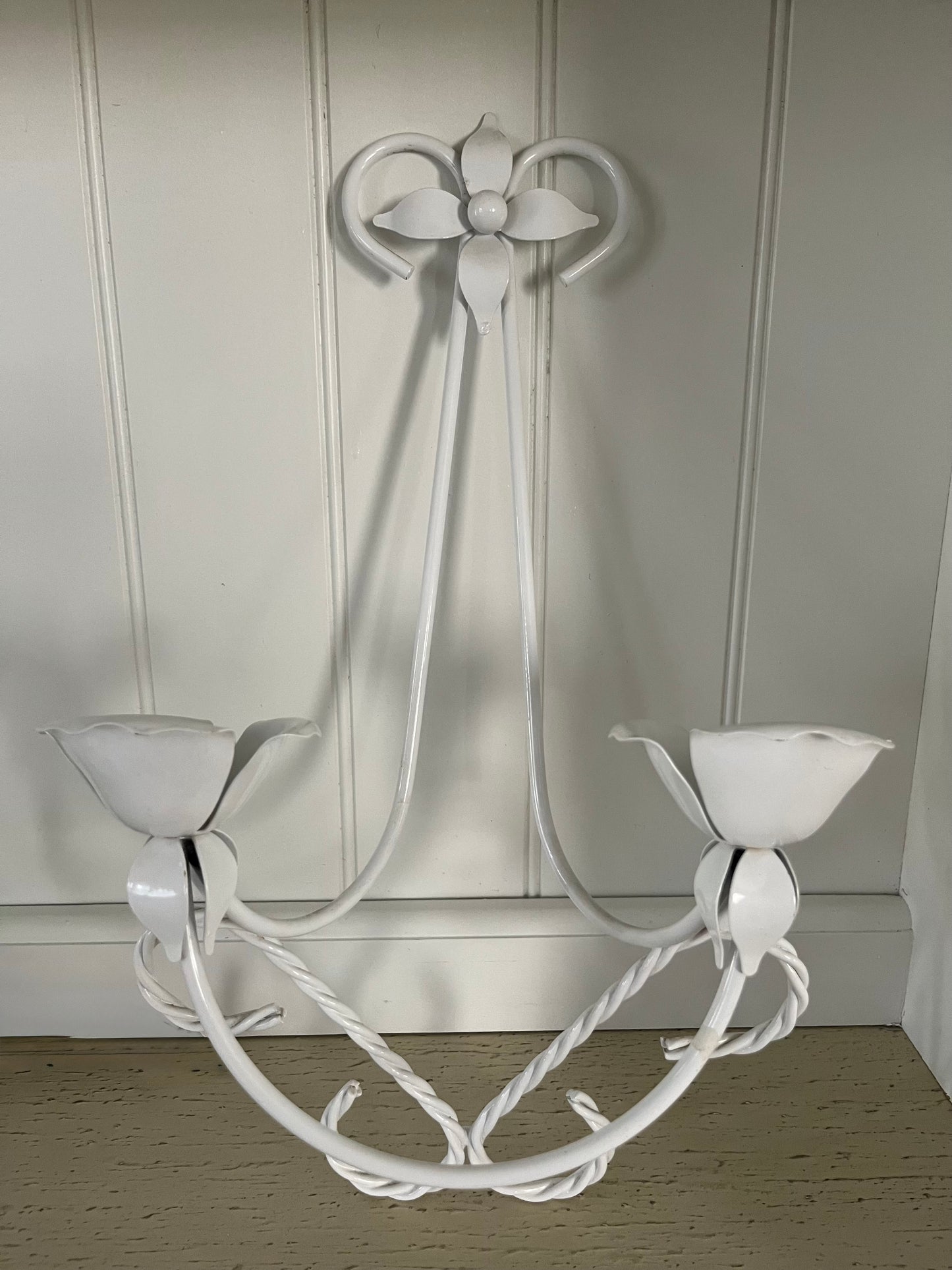 Vintage C.1980’s White Tole Double Wall Candle Sconce with tulip-shaped candle cups, and a four-pointed floral petal at the top