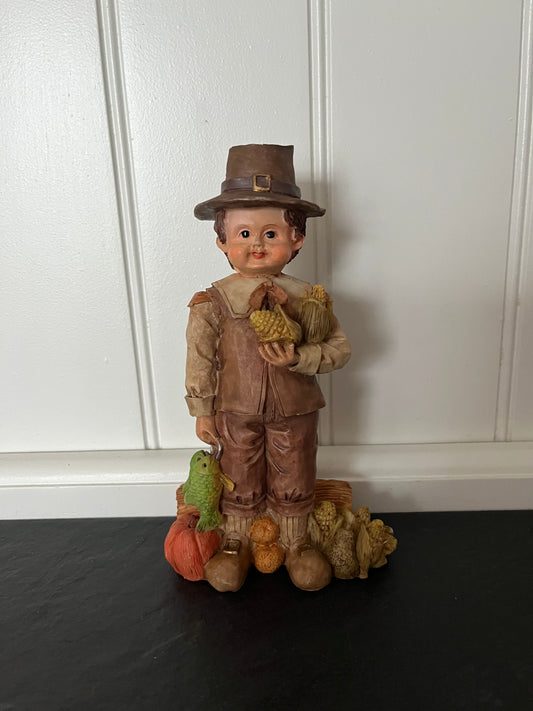 Vintage Fall Harvest Pilgrim Boy Figurine with Pumpkin, Fish & Wheat Sheaves – 1990s Thanksgiving Collectible (6½”)